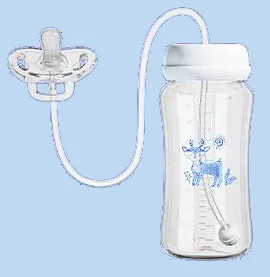 Le biberon avec son tube et sa tétine souple